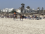 Pferdereiten am belebten Strand