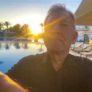 Sunset Selfie at Tropical Poolside Paradise
